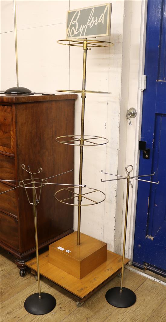 Four tie racks and a Byford sock stand, H.178cm
